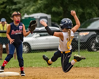 DIANNA OATRIDGE | THE VINDICATOR Austintown's Sam Severn awaits the throw to second base as Tallmadge's Bayton Justice slides in for a steal during the loser's bracket final of the 9-10 Little League state tournament in Tallmadge. Austintown lost 7-3.