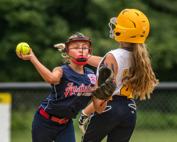 DIANNA OATRIDGE | THE VINDICATOR Austintown's Sam Severn forces out Tallmadge's Allie Gohr at second base and throws to first base for the double play during the loser's bracket final of the 9-10 Little League state tournament in Tallmadge. Austintown lost 7-3.