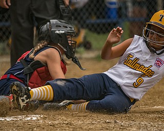 DIANNA OATRIDGE | THE VINDICATOR Austintown's Kylie Folkwein tags out Tallmadge's Gabriella Harp during the loser's bracket final of the 9-10 Little League state tournament in Tallmadge. Austintown lost 7-3.