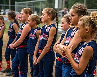 DIANNA OATRIDGE | THE VINDICATOR Austintown's 9-10 Little League softball team reacts after their 7-3 loss to Tallmadge in the loser's bracket of the state tournament at Indian Hills Field in Tallmadge.