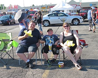 Neighbors | Jessica Harker.Ron Moore, Kenny Parbel and Lisa Moore sat and listened to different bands at the July 1 Austintown Fourth of July event.
