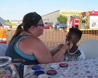 Neighbors | Jessica Harker.Jeremiah Currie got his face painted by a volunteer at the July 1 Austintown Fourth of July event.