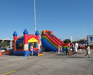Neighbors | Jessica Harker.Different bounce houses were on display July 1, free for children to use at the Austintown fourth of July event at the Austintown plaza.