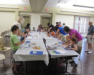 Neighbors | Jessica Harker.Children and their families participated in a craft making portion of Family Story time at the Boardman library July 11.