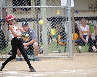 Canfield's Sam Economous hits the ball during the 10U softball state championship game against Tallmadge at Indian Hills Field on Thursday. Canfield won 5-2. EMILY MATTHEWS | THE VINDICATOR