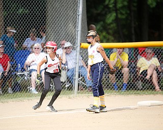 Canfield's Sam Economous takes a lead off third during the 10U softball state championship game against Tallmadge at Indian Hills Field on Thursday. Canfield won 5-2. EMILY MATTHEWS | THE VINDICATOR