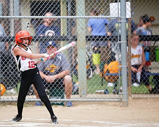 Canfield's Paris Lindgren hits the ball during the 10U softball state championship game against Tallmadge at Indian Hills Field on Thursday. Canfield won 5-2. EMILY MATTHEWS | THE VINDICATOR