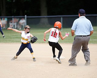 Canfield's Paris Lindgren gets safely to second before Tallmadge's Marissa Charton could tag her during the 10U softball state championship game at Indian Hills Field on Thursday. Canfield won 5-2. EMILY MATTHEWS | THE VINDICATOR