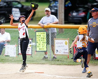 Canfield's Sydney Lutz stretches to catch the ball to get Tallmadge's Marissa Charton out during the 10U softball state championship game at Indian Hills Field on Thursday. Canfield won 5-2. EMILY MATTHEWS | THE VINDICATOR