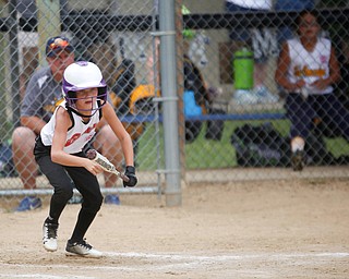 Canfield's Brooke O'Palick starts to run after bunting during the 10U softball state championship game against Tallmadge at Indian Hills Field on Thursday. Canfield won 5-2. EMILY MATTHEWS | THE VINDICATOR