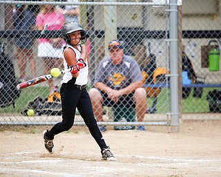 Canfield's Sydney Lutz hits the ball during the 10U softball state championship game against Tallmadge at Indian Hills Field on Thursday. Canfield won 5-2. EMILY MATTHEWS | THE VINDICATOR