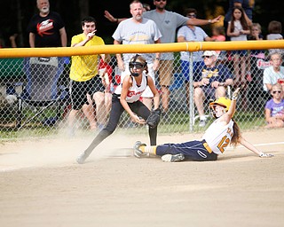 Canfield's Sam Economous gets Tallmadge's Larissa Taylor out at third during the 10U softball state championship game at Indian Hills Field on Thursday. Canfield won 5-2. EMILY MATTHEWS | THE VINDICATOR