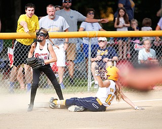 Canfield's Sam Economous smiles after getting Tallmadge's Larissa Taylor out at third during the 10U softball state championship game at Indian Hills Field on Thursday. Canfield won 5-2. EMILY MATTHEWS | THE VINDICATOR