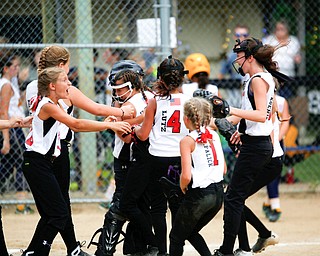 Canfield celebrates after winning the 10U softball state championship game against Tallmadge at Indian Hills Field on Thursday. EMILY MATTHEWS | THE VINDICATOR