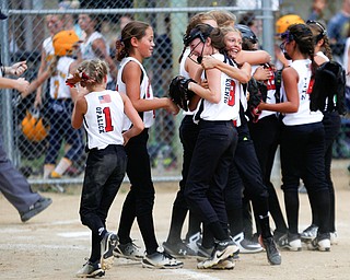 Canfield celebrates after winning the 10U softball state championship game against Tallmadge at Indian Hills Field on Thursday. EMILY MATTHEWS | THE VINDICATOR