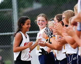 Canfield's Kyleigh Golden high-fives Tallmadge players after Canfield won the 10U softball state championship game at Indian Hills Field on Thursday. EMILY MATTHEWS | THE VINDICATOR