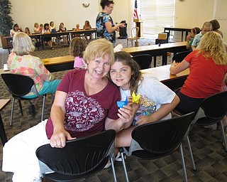 Neighbors | Jessica Harker.Virginia and Addy Draa showed off their finished rabbits heads at the Paper Magic event July 24 at the Austintown library.