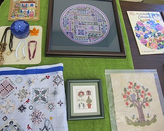 Neighbors | Natalie Wright.Some of the intricate past projects from members of the Youngstown Embroidery Guild were on display for inspiration at the Boardman library on July 20.