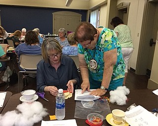 Neighbors | Submitted.A volunteer from the Youngstown Embroidery Guild went over the instructions for the July 20 project at the Boardman library's Crazy Quilting event.