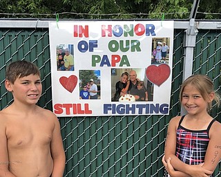 Neighbors | Submitted.Canfield Swim Club swim team members Anthony and Ava Mazzella honored their grandfather during the team’s annual Swim-A-Thon, which raised money for the Showers Family Center For Childhood Cancer at Akron Children’s Hospital in Boardman, on July 19.