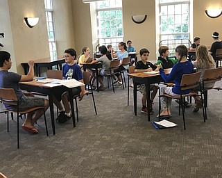 Neighbors | Jessica Harker.Children practiced learning and understand each others names in sign language at the ASL Camp July 26 at the Poland library.