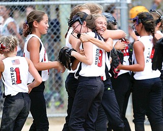 Canfield celebrates after winning the 10U softball state championship game against Tallmadge at Indian Hills Field on Thursday.
