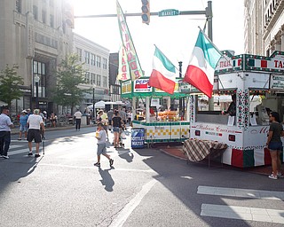 People walk around the Greater Youngstown Italian Fest on Friday. EMILY MATTHEWS | THE VINDICATOR