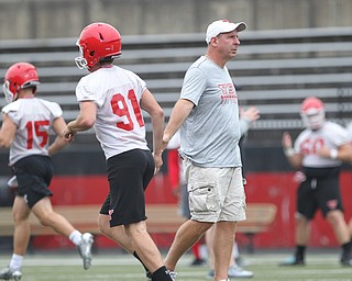 YSU Head Coach Bo Pelini shakes hands with place kicker, Colin Burdette (91),  during practice at Stambaugh Stadium on Friday morning.  Dustin Livesay  |  The Vindicator  8/3/18  YSU