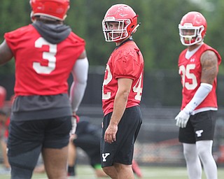 Youngstown State linebacker Armand Dellovade (42) helps direct his defensive teammates to their spots during practice at Stambaugh Stadium on Friday morning.  Dustin Livesay  |  The Vindicator  8/3/18  YSU