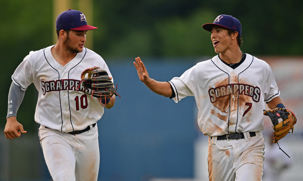 NILES, OHIO - AUGUST 6, 2018: Henry Pujols, left, is congratulated by Tyler Freeman after throwing to first to get out State College Spikes' Stanley Espinal in the fourth inning of a baseball game, Monday night at Eastwood Field in Niles. DAVID DERMER | THE VINDICATOR