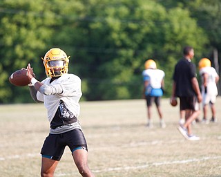 Zane Cylar prepares to throw the ball at East High School's football practice Tuesday evening.