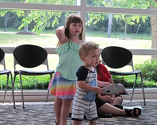 Neighbors | Jessica Harker.Annalise and Jordan Kenyon danced around during the Baby Brilliant event July 3 at the Austintown library.