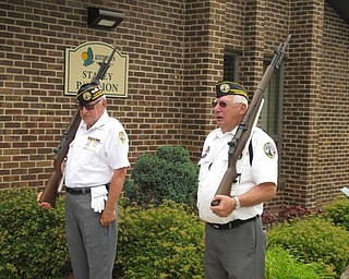 Neighbors | Jessica Harker.Amel Siwecky and Robert Cooper of the DAV preformed drills on the sidewalk outside the Austintown Farmers Market on July 2.