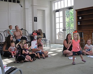Neighbors | Jessica Harker .Children and their guardians sang along to songs and danced during the weekly Baby Brilliant event at the Poland library July 25.