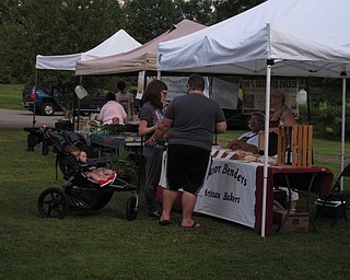 Neighbors | Jessica Harker.Sarah and Townsend Bendersmith shopped at the farmers market Monday July 30 with their children Cormac and Madigan at Austintown Park.