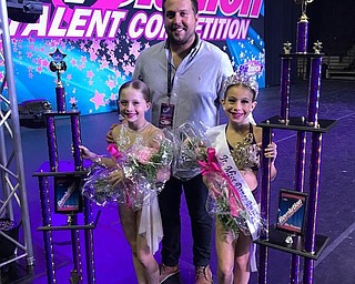 Neighbors | Submitted.Two students at Epic Dance Complex were selected to recompete in the National Title Pageant. Only three dancers from each age category earn the chance to dance for the title of Miss Dance America. Hannah Lintner (left), from Austintown, earned a Revolutionary Award, first place in her category, second overall high score and first runner-up to Mini Miss Dance America. Ava Briceland (right), from Boardman, earned a Revolutionary Award, first place in her category and third place overall. She came from behind in the National Title Pageant and was crowned Junior Miss Dance America. They are pictured with Tommy Porter.