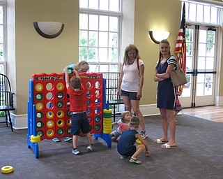 Neighbors | Jessica Harker.Children play a large connect four game at the Poland library on Aug. 2 for the end of the summer Ice Cream Bash.