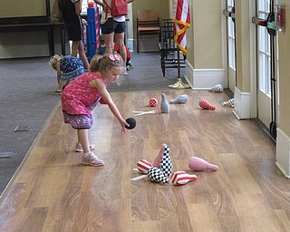 Neighbors | Jessica Harker.Lillian Morgan played a bowling game at the end of the year Ice Cream Bash on Aug. 2.