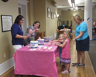 Neighbors | Jessica Harker.Lillian and Madison Morgan, along with their grandma Candy Morgan, chose their ice cream flavor at the third annual Ice Cream Bash on Aug. 2.