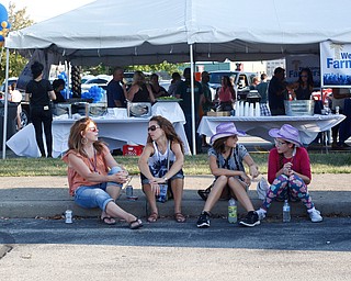 From left, Jennifer Fentress, Ashley Mansour, Sydney Mansour, 12, and Samantha Frohman, 12, all of Hubbard, sit in the tailgating parking lot before the Florida Georgia Line Concert on Saturday. EMILY MATTHEWS | THE VINDICATOR