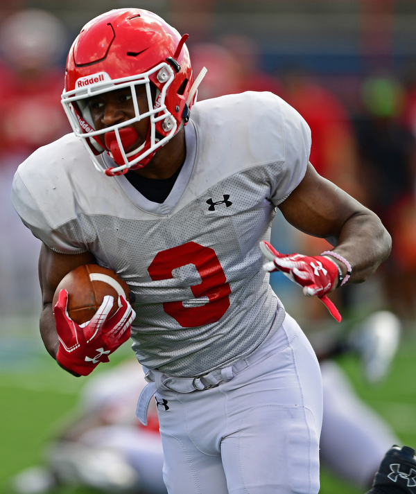 AUSTINTOWN, OHIO - AUGUST 11, 2018: Youngstown State's Braxton Chapman runs the ball during the teams practice, Saturday morning at Austintown Fitch High School. DAVID DERMER | THE VINDICATOR