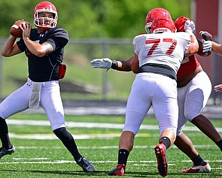 AUSTINTOWN, OHIO - AUGUST 11, 2018: Youngstown State's Nathan Mays picks up a block from Dan Becker during the teams practice, Saturday morning at Austintown Fitch High School. DAVID DERMER | THE VINDICATOR