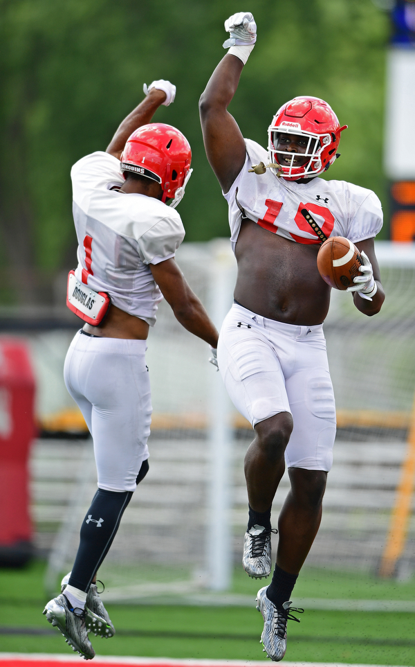 AUSTINTOWN, OHIO - AUGUST 11, 2018: Youngstown State's Charles Reeves Jr., right, celebrates with Zach Farrar after scoring a touchdown during the teams practice, Saturday morning at Austintown Fitch High School. He would score on the play. DAVID DERMER | THE VINDICATOR