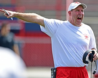 AUSTINTOWN, OHIO - AUGUST 11, 2018: Youngstown State head coach Bo Pelini shouts instructions during the teams practice, Saturday morning at Austintown Fitch High School. He would score on the play. DAVID DERMER | THE VINDICATOR