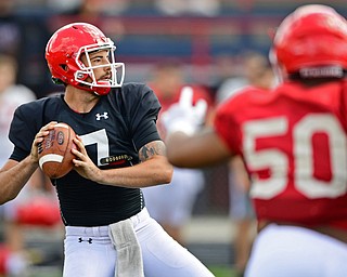 AUSTINTOWN, OHIO - AUGUST 11, 2018: Youngstown State's Nathan Mays drops back to pass while being pressured by Shereif Bynum during the teams practice, Saturday morning at Austintown Fitch High School. He would score on the play. DAVID DERMER | THE VINDICATOR