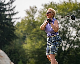DIANNA OATRIDGE | THE VINDICATOR Shirley Lisk reacts as she watches her tee shot on Hole No. 2 during the Ladies 2-player Championship of the Greatest Golfer of the Valley held at Trumbull Country Club in Warren on Wednesday.