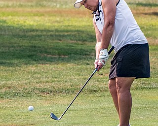 DIANNA OATRIDGE | THE VINDICATOR Kim Bellatto chips on to the No. 3 green during the Ladies 2-player Championship of the Greatest Golfer of the Valley held at Trumbull Country Club in Warren on Wednesday.