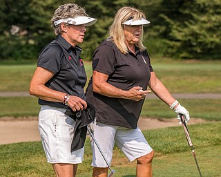 DIANNA OATRIDGE | THE VINDICATOR Ellen Tressel (left) and Pam Porter (right) strategize during the Ladies 2-player Championship of the Greatest Golfer of the Valley held at Trumbull Country Club in Warren on Wednesday.