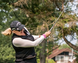 DIANNA OATRIDGE | THE VINDICATOR Kim Staton takes her second shot during the Ladies 2-player Championship of the Greatest Golfer of the Valley held at Trumbull Country Club in Warren on Wednesday.