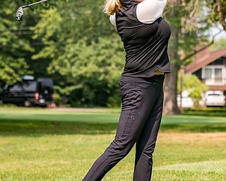 DIANNA OATRIDGE | THE VINDICATOR Kim Staton watches her second shot during the Ladies 2-player Championship of the Greatest Golfer of the Valley held at Trumbull Country Club in Warren on Wednesday.